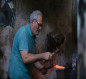 بالصور:اصحاب حرف يدوية يعملون باعمال شاقة  بظل ارتفاع درجات الحرارة وانعدام الكهرباء  بمحافظة بابل